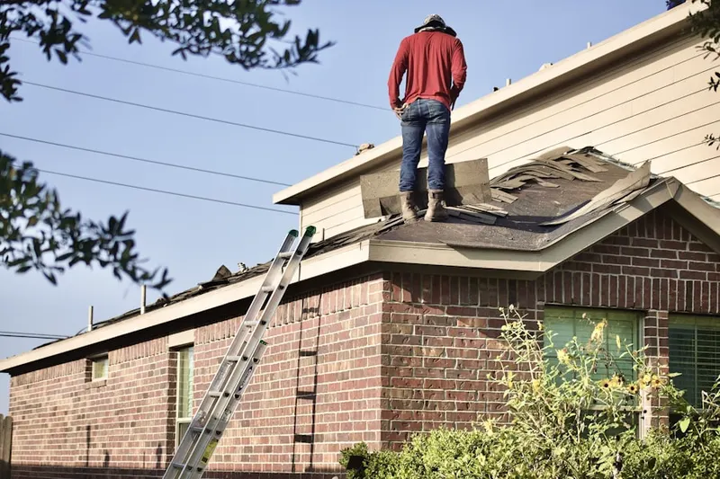 Professional roofer working on a residential roof in Burr Ridge